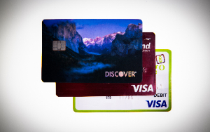   Three credit cards are stacked at an angle.